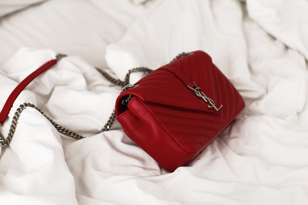 red ysl chain bag on bed