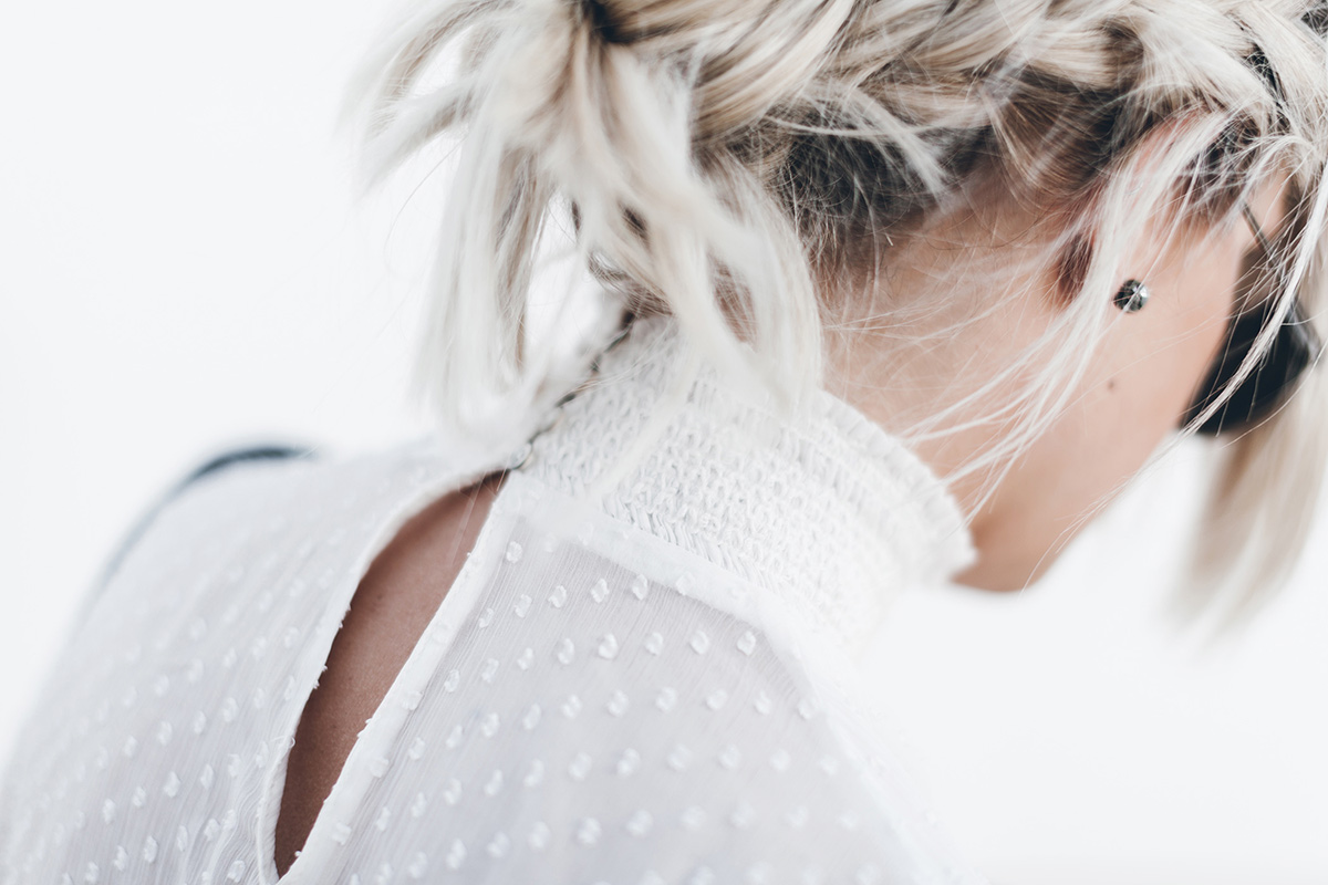 how to wear a white high neck lace top with braid