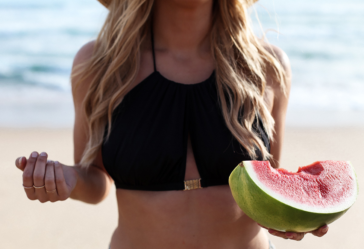 Fashion & travel blogger Lisa Hamilton from See Want Shop wearing a L'Agent by Agent Provocateur bikini with a watermelon at the beach
