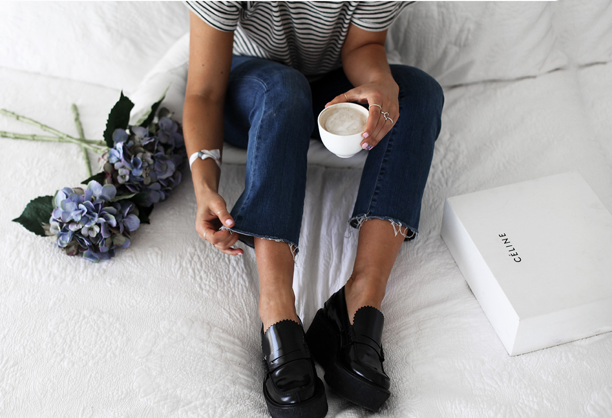Style blogger Lisa Hamilton wears Celine black platform loafers & Paige Denim jeans from Yoox online store