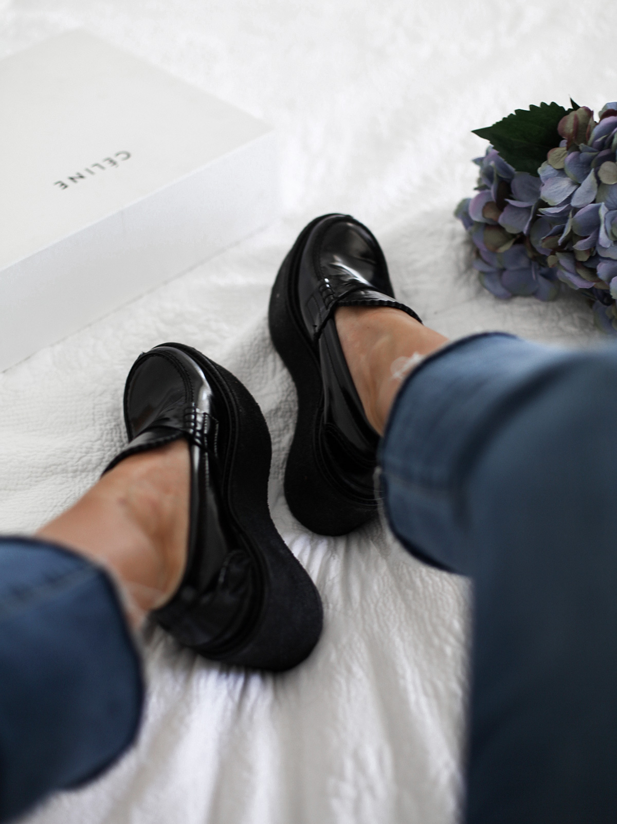 Style blogger Lisa Hamilton wears Celine black platform loafers & Paige Denim crop jeans from Yoox online store