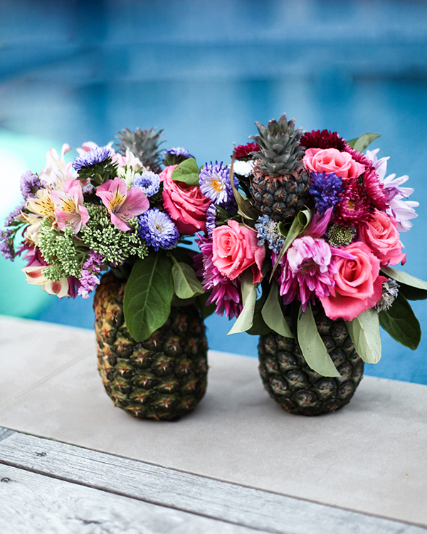 Palm Springs party, pineapple vases, flowers