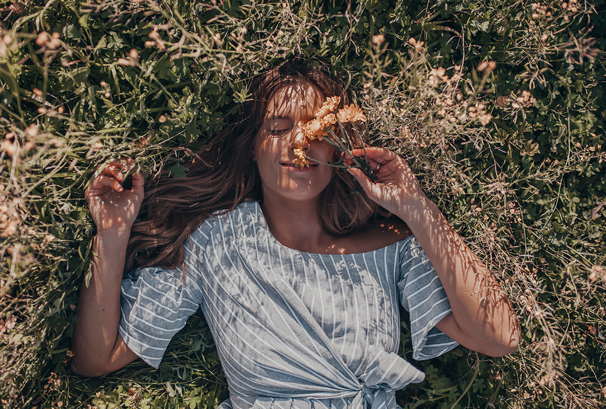 lying in daffodil field