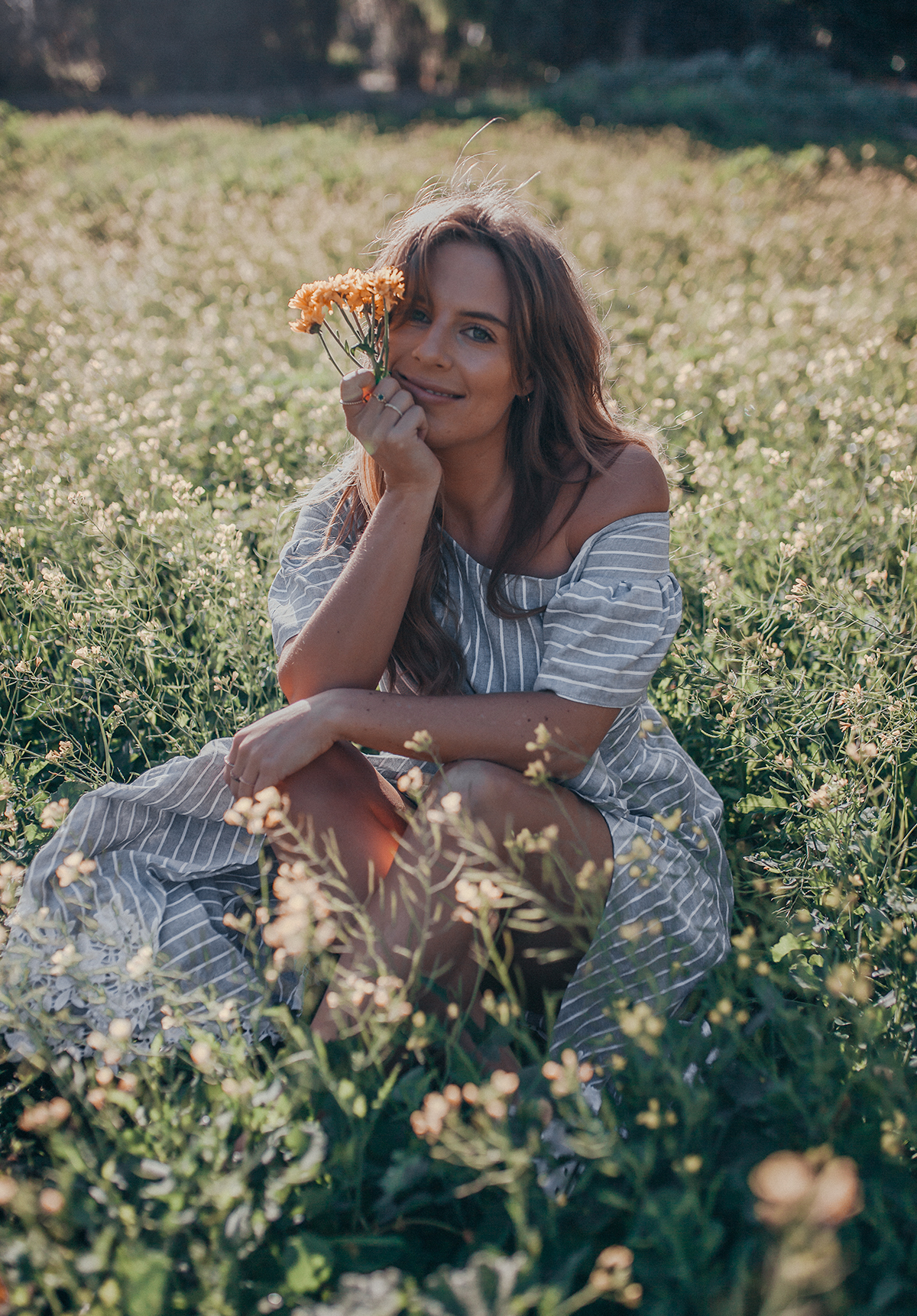 sitting in a daffodil field