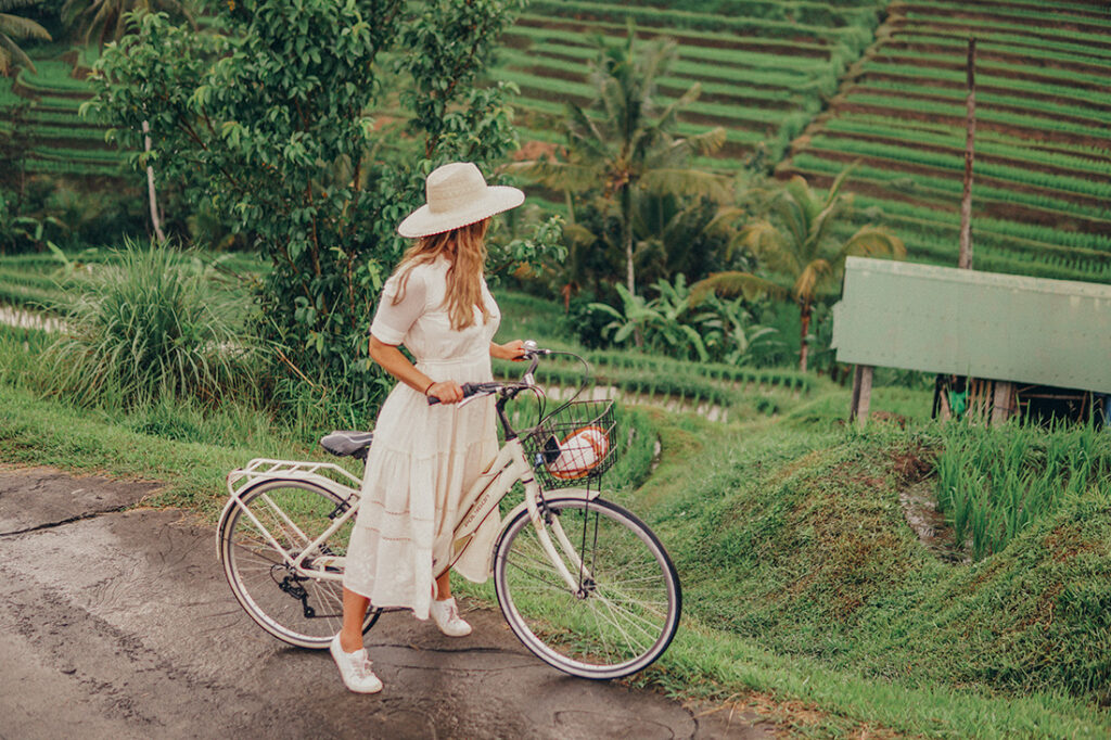 bike riding through rice fields in Bali